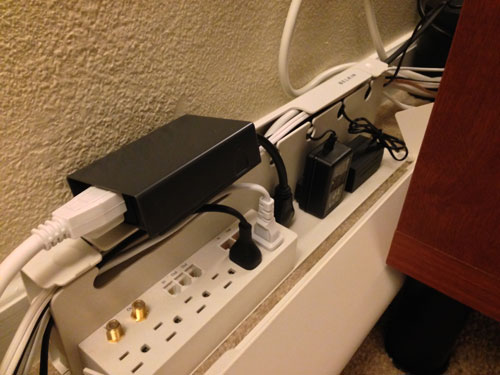 No less awesome are the surge protectors. Lay speaker cable along the top channel.