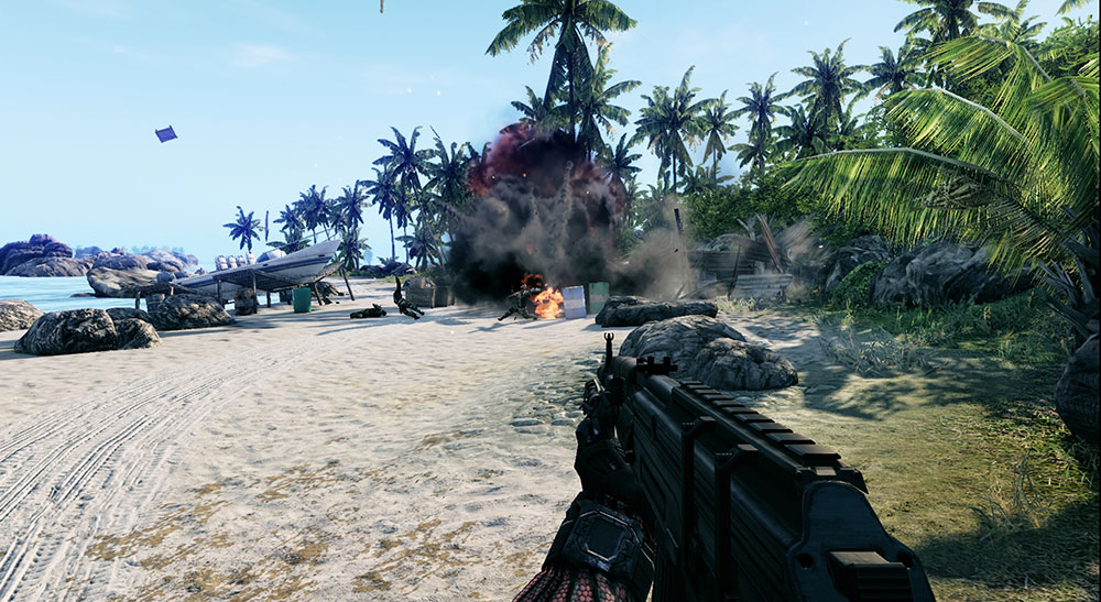 Crysis screenshot, an explosion on the beach sends two soldiers flying.