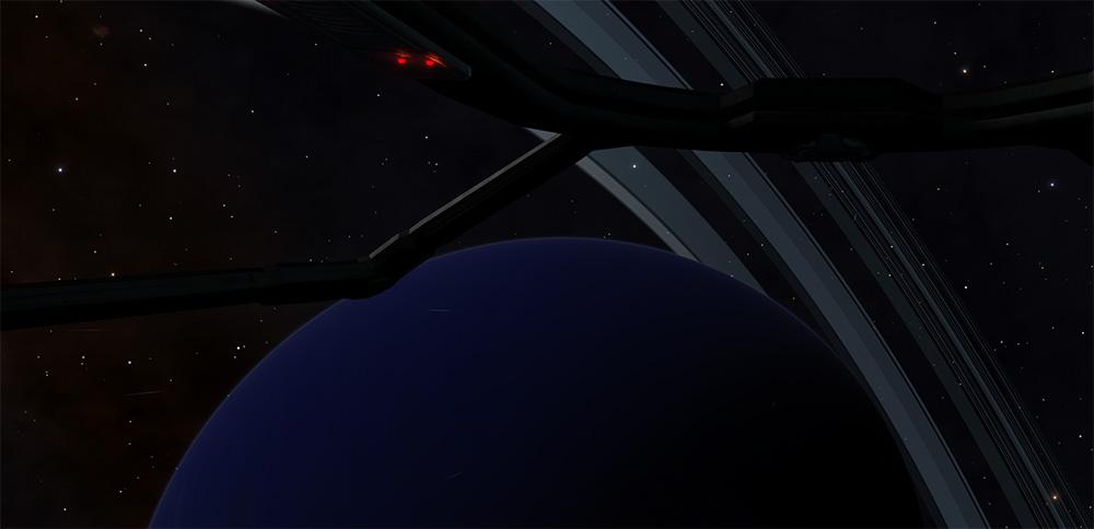 A blue ringed planet is visible through part of a spaceship cockpit